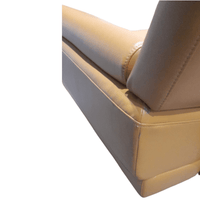 Close-up of a Yellow leather armchair with stitching details on a white background