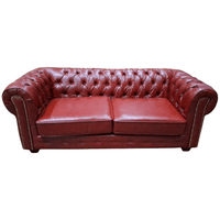 red bonded leather sofa on a white background