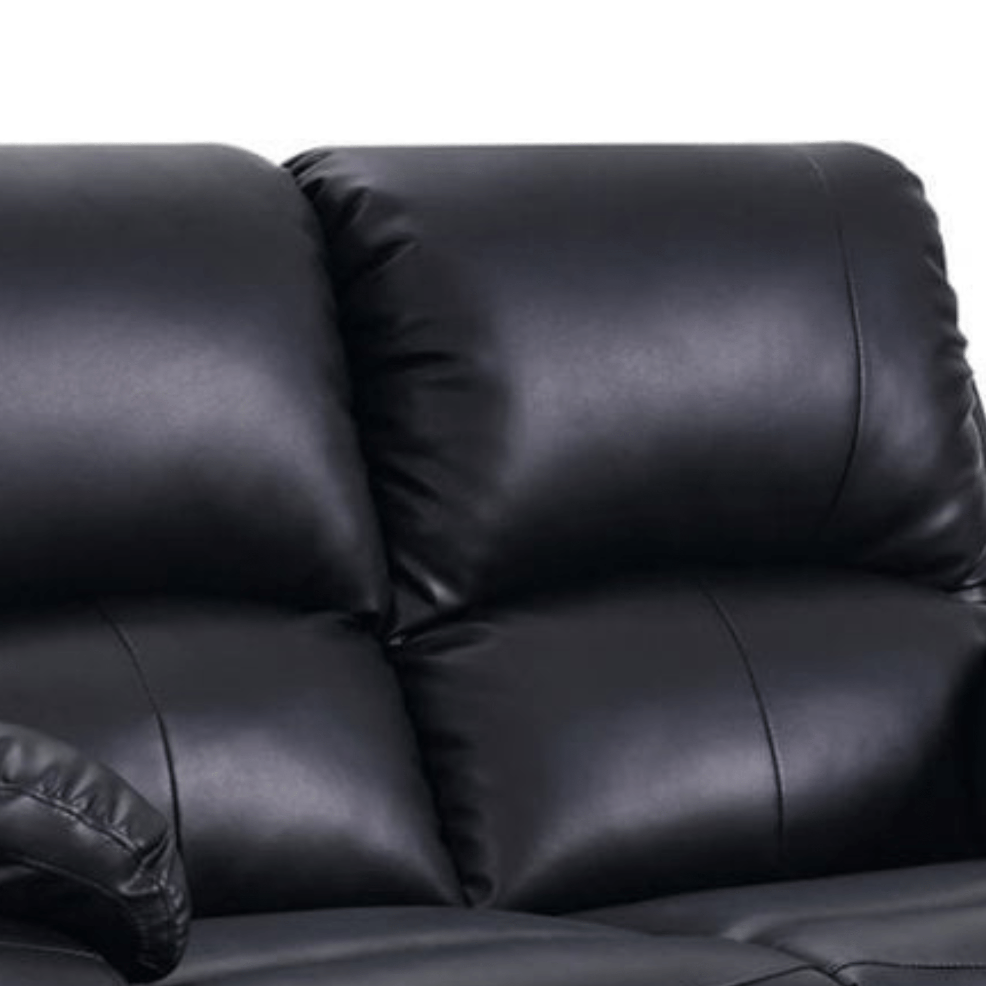 Close-up of a black leather sofa with a white background