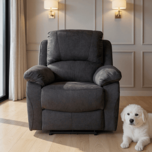 Grey armchair in a room with a white dog sitting next to it