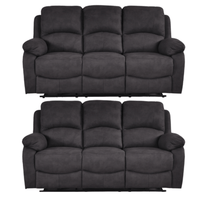 Two black sofas on a white background