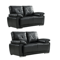 Two black leather sofas on a white background