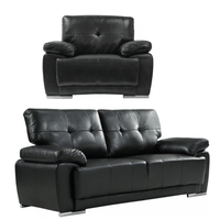 Black leather armchair and sofa set on a white background