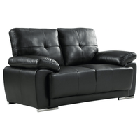 Black leather sofa on a white background