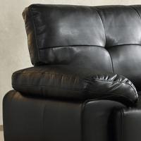 Close-up of a black leather recliner chair