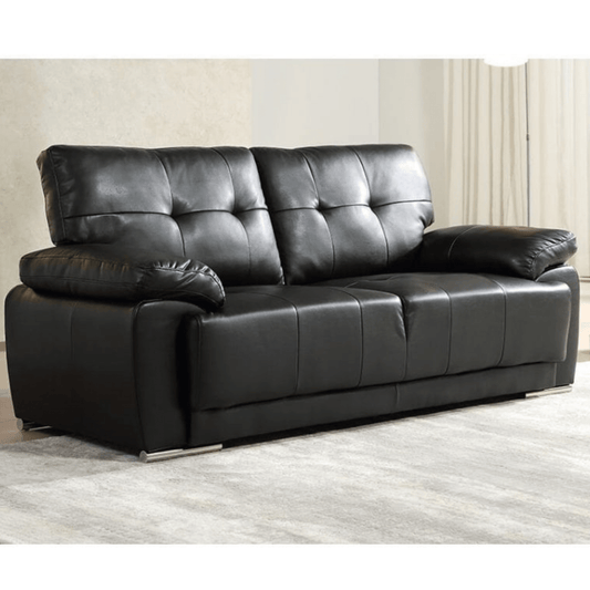 Black leather sofa in a room with light-colored walls and flooring