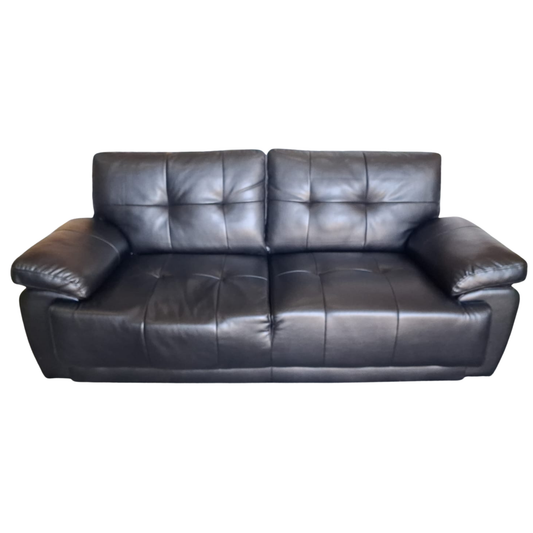 Black leather sofa on a white background