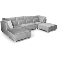 Gray sectional sofa with ottoman on a white background