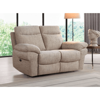 Beige recliner sofa in a living room setting with large windows and a lamp.