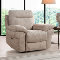 Beige recliner chair in a room with large windows and a lamp.