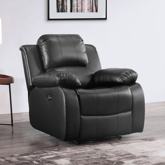 Black leather recliner chair in a room with a framed picture on the wall.
