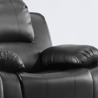Close-up of a black leather recliner chair