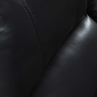 Close-up of black leather texture with stitching detail