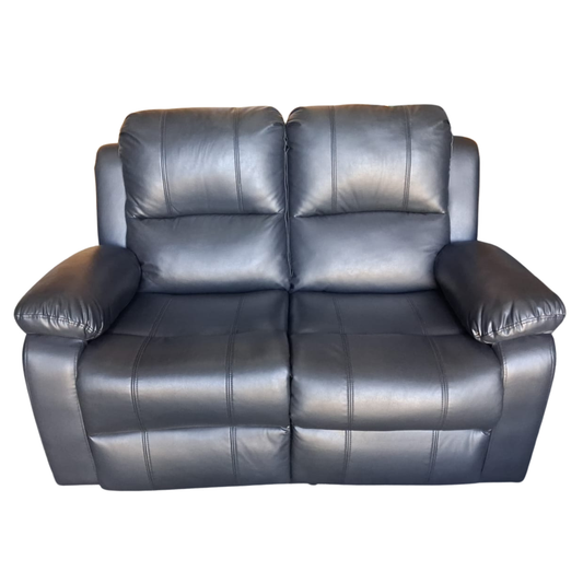 Gray leather loveseat on a white background