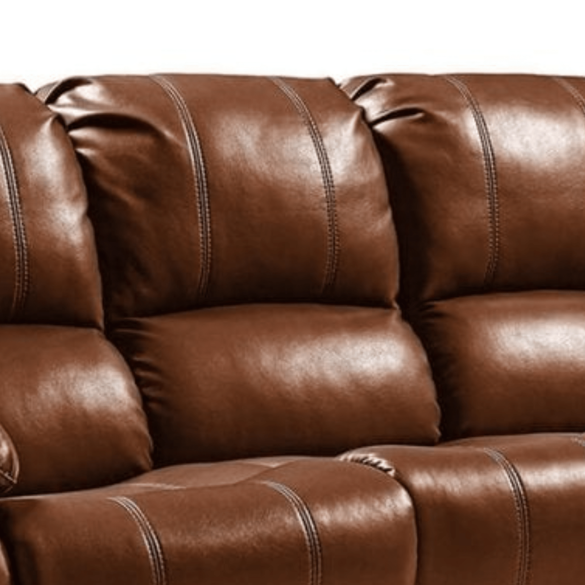 Close-up of a brown leather sofa with visible stitching