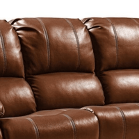 Close-up of a brown leather sofa with visible stitching