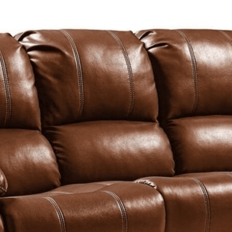 Close-up of a brown leather sofa with visible stitching