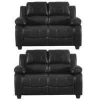 Two black leather recliners on a white background