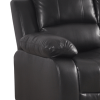 Close-up of a black leather recliner chair with a pillow on a white background