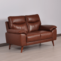 Vantage Tan 2-Seater Sofa angled view in living room set, highlighting cushions, fabric texture, and modern design details