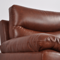 Close-up of Vantage tan armchair highlighting its plush cushions and modern design