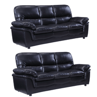 Two black leather sofas on a white background