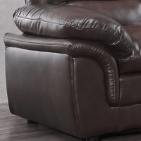 Brown leather recliner chair on a wooden floor.
