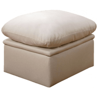 Beige ottoman with cushion on a white background
