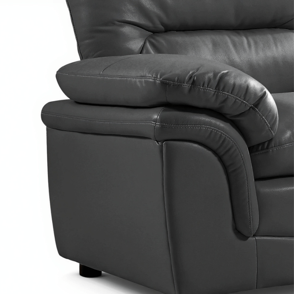 Close-up of a dark gray leather recliner chair on a white background close up