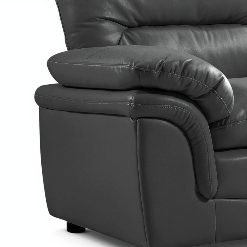 Close-up of a dark gray leather recliner chair on a white background close up