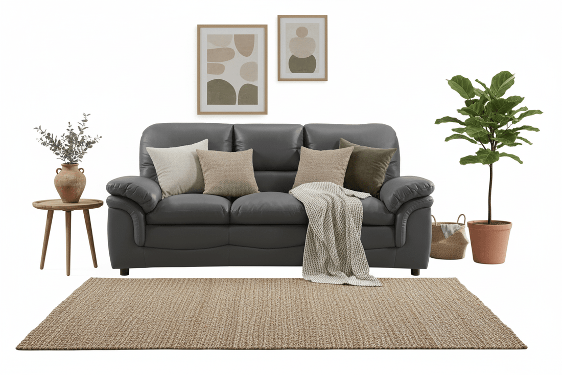 Grey Leather 3 seater sofa on a moodbaord. with various living room items such as rugs and side tables  on a white background 