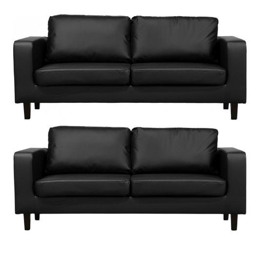 Two black leather sofas on a white background