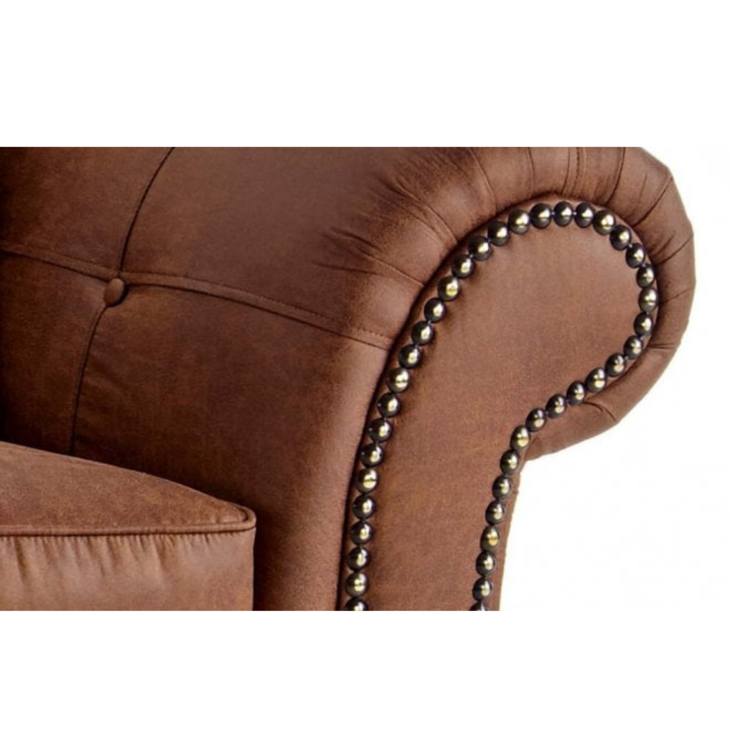 Brown fabric  upholstered chair with decorative metal trim on a white background