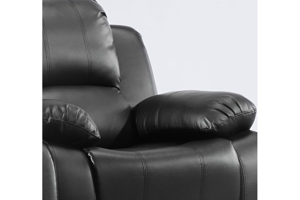 Close-up of a black leather recliner chair on a white background