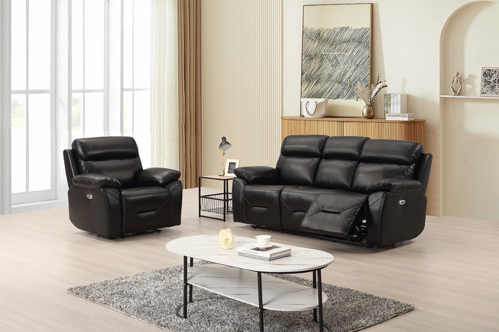 Black leather recliner sofa set in a living room with a coffee table and decor items.