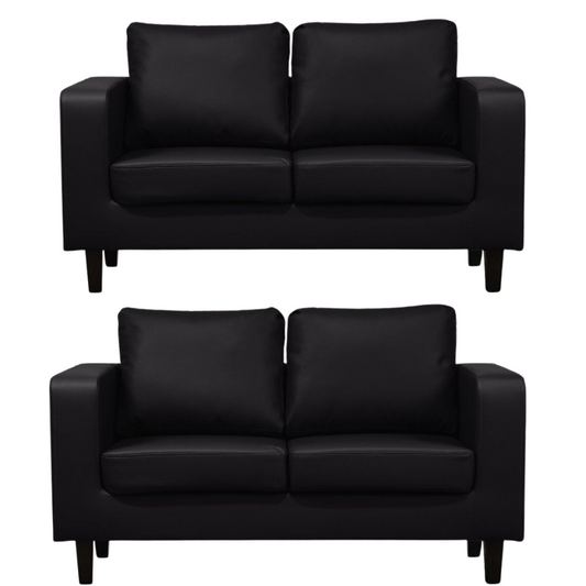 Two black leather sofas on a white background