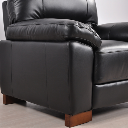 Close-up view of the Dalmore Black Armchair in a modern room setting with neutral tones and soft lighting.