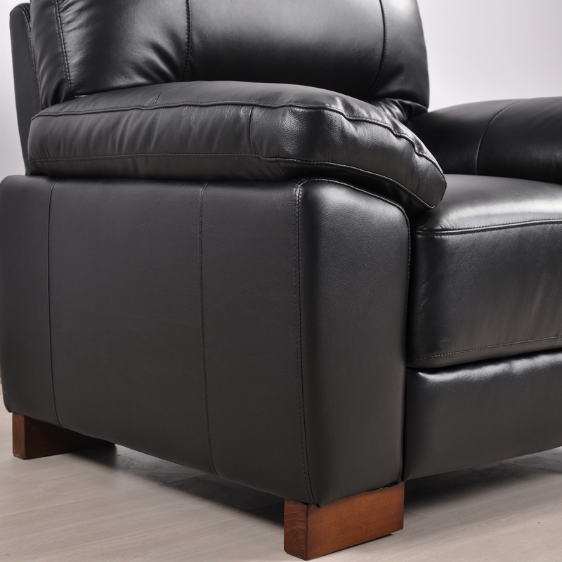 Close-up view of the Dalmore Black Armchair in a modern room setting with neutral tones and soft lighting.