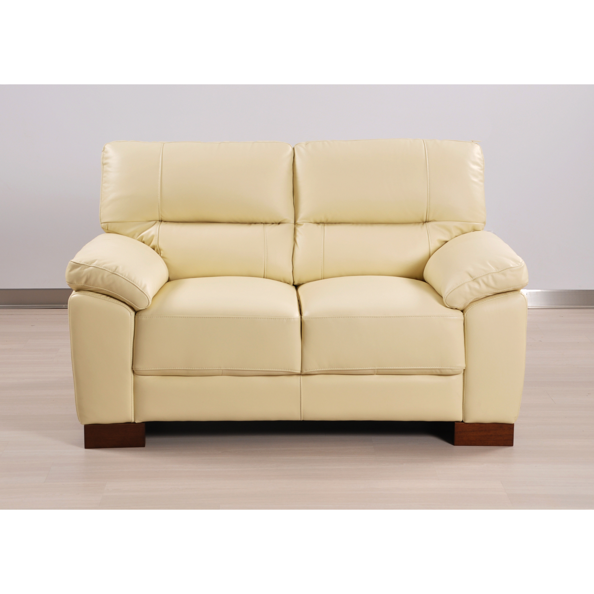 Dalmore Cream 2 Seater – front-facing cream-colored two-seater sofa in a modern living room setting.