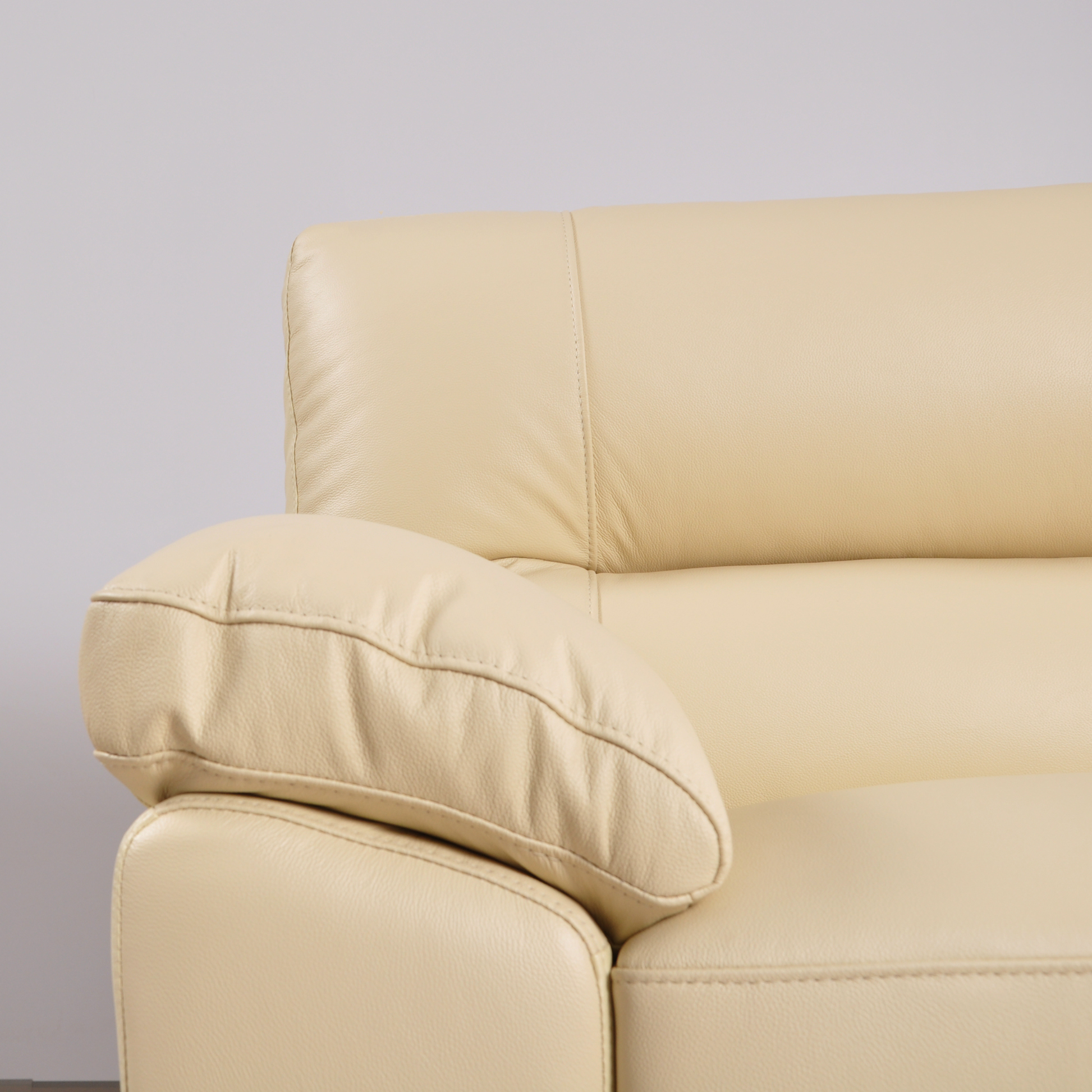 Cidliano Cream Armchair – detailed close-up of cream-colored armchair showcasing upholstery and design features.