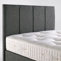 headboard of grey fabric sofa close up