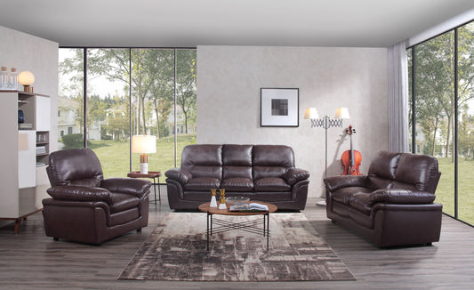 Brown leather sofa set in a modern living room with large windows.
