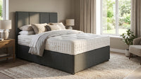grey fabric bed in a room setting