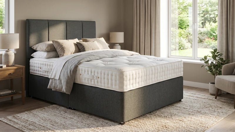 grey fabric bed in a room setting