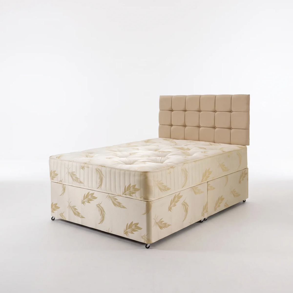 A single bed frame with a tufted beige headboard and cream fabric base featuring a gold leaf pattern, photographed on a seamless white studio background.