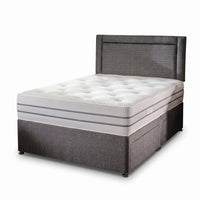 Grey fabric bed in a white background