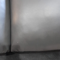 close up of outlet leather grey 3 seater sofa