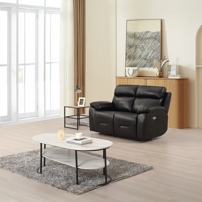 Renato black two-seater sofa in a modern living room setting, styled with neutral décor, soft lighting, and contemporary furnishings.