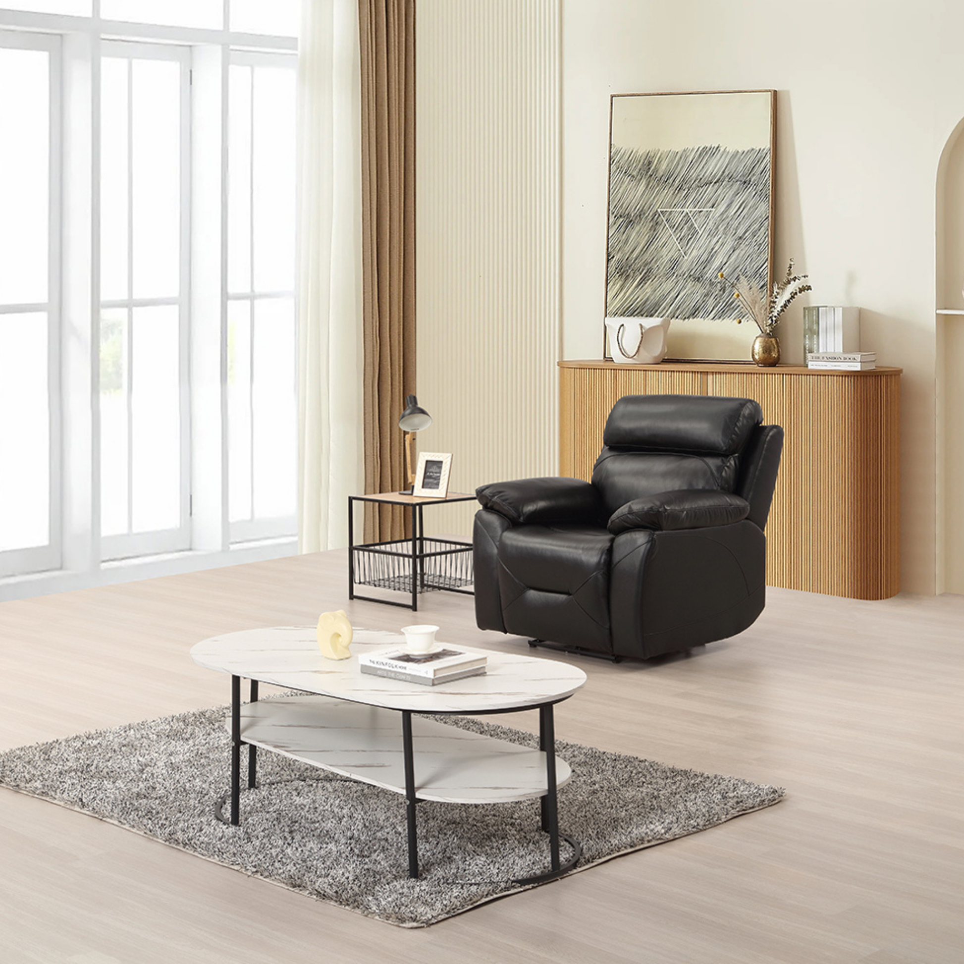 Renato black armchair in a modern living room setting, styled with neutral décor, soft lighting, and contemporary accents.