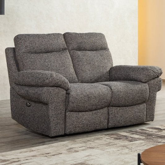 Gray recliner sofa in a room with a neutral color scheme